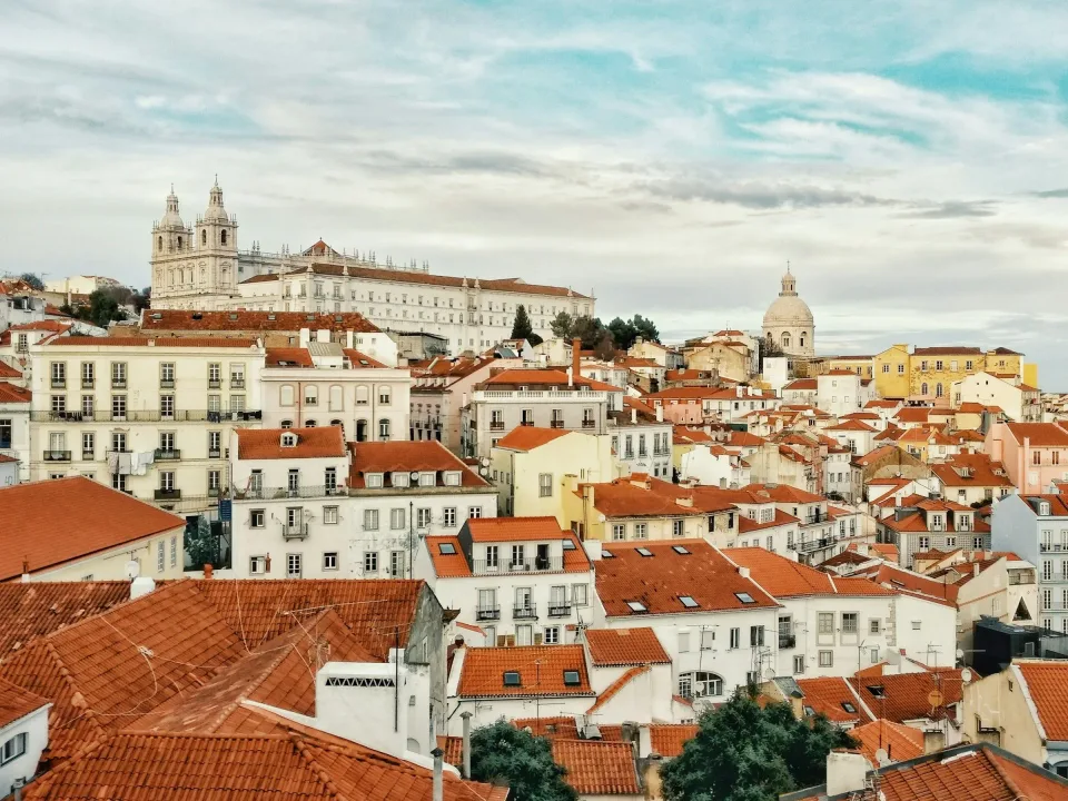 Rooftops of Alfama in Lisbon with São Vicente de Fora church on the skyline